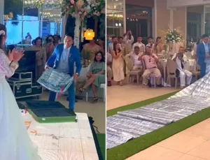 Damattan geline ilginç hediye: 17 bin doları halı gibi gelinin önünde serdi