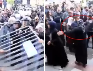 DEM Partililerin polis barikatlarına saldırdığı ana başörtülü kadın damga vurdu
